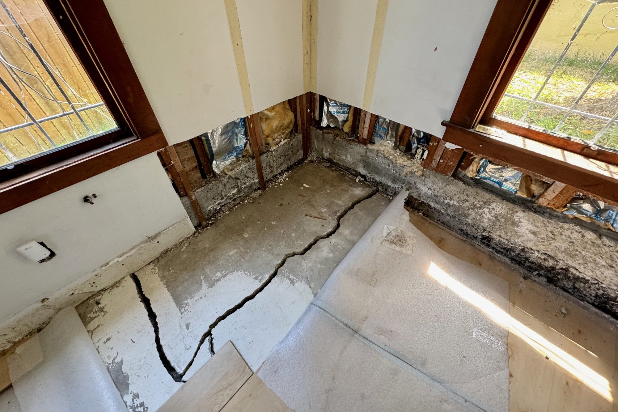Cracked slab in a basement area of a distressed home in Oakland on a recent tour