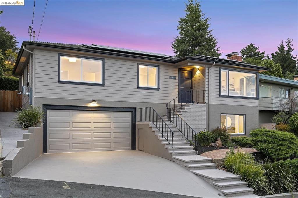 Exterior of home, lower ADU with large garage and Bay views