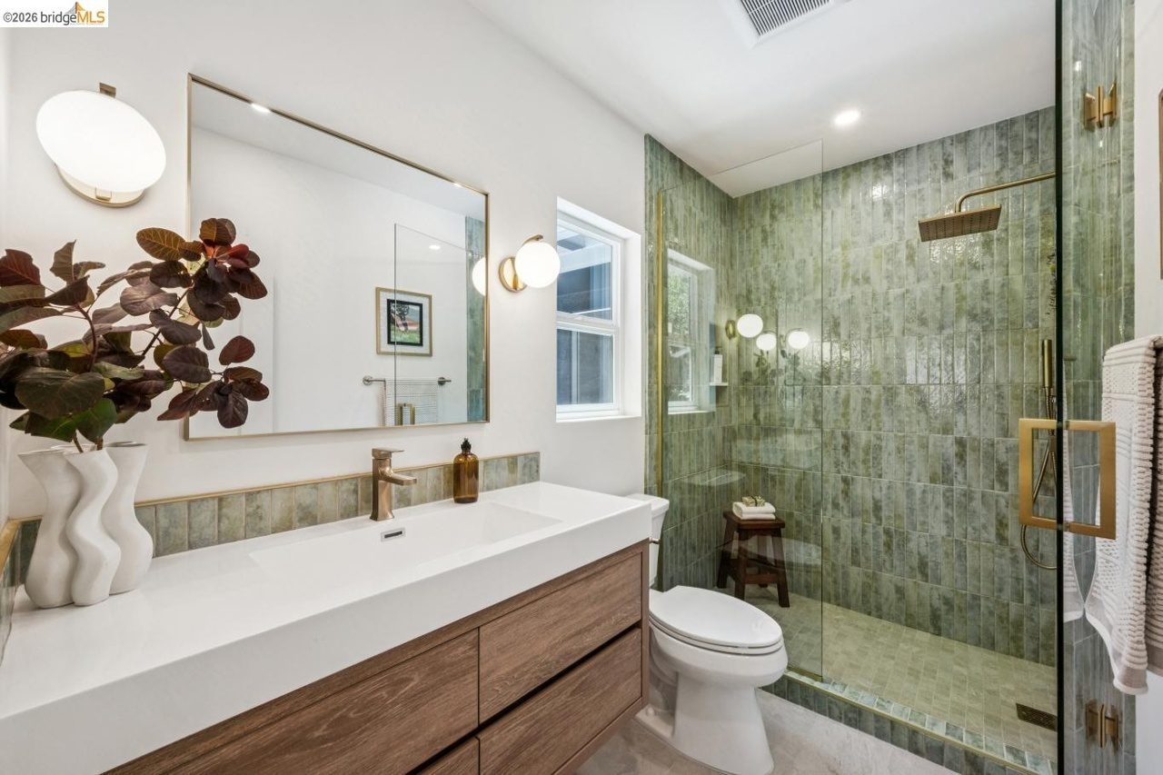 New primary en suite bathroom, luxury Italian tile and floating quartz vanity with green tile