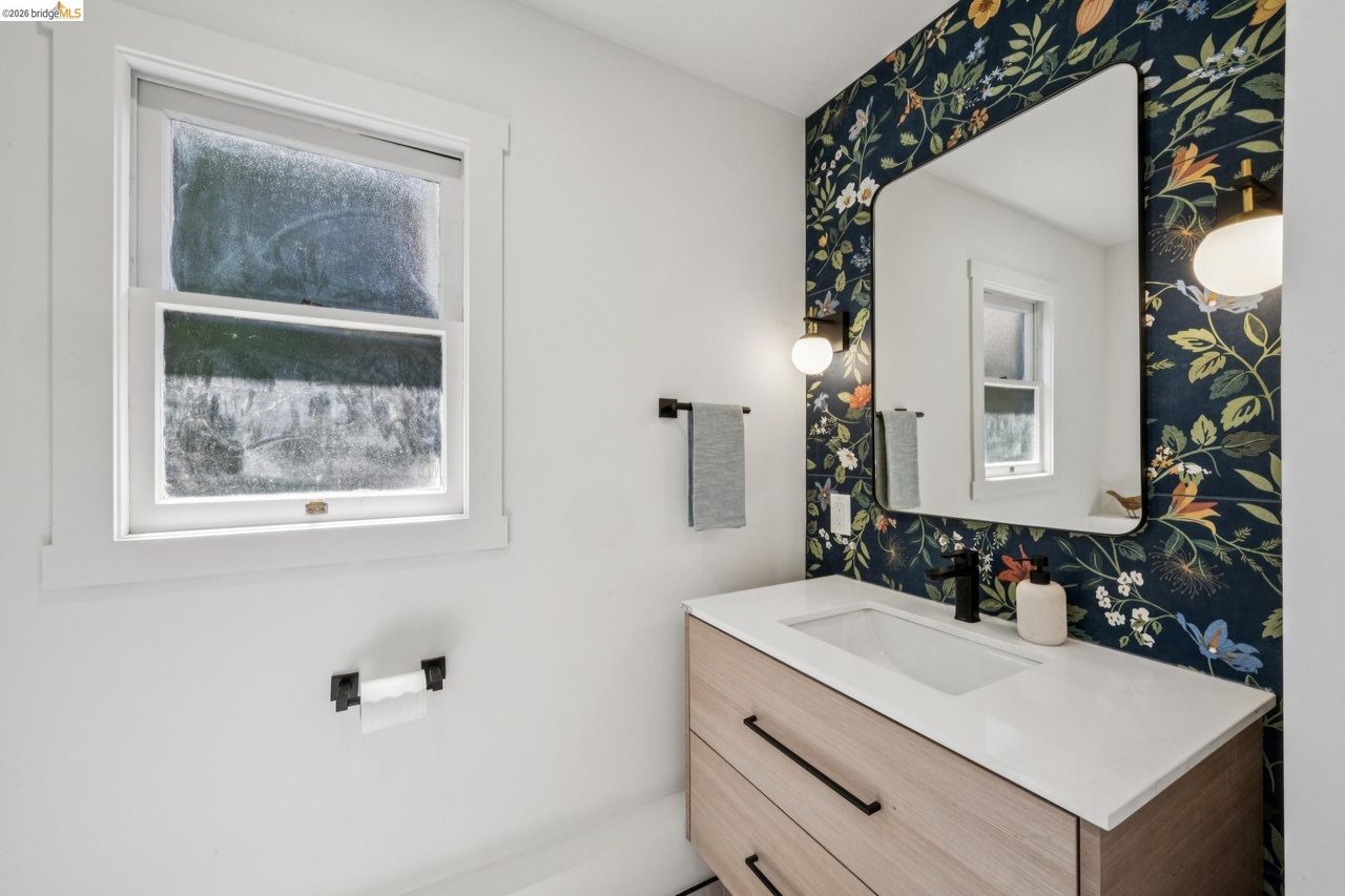 Floral Italian tile design in this backyard accessible 1/2 bath